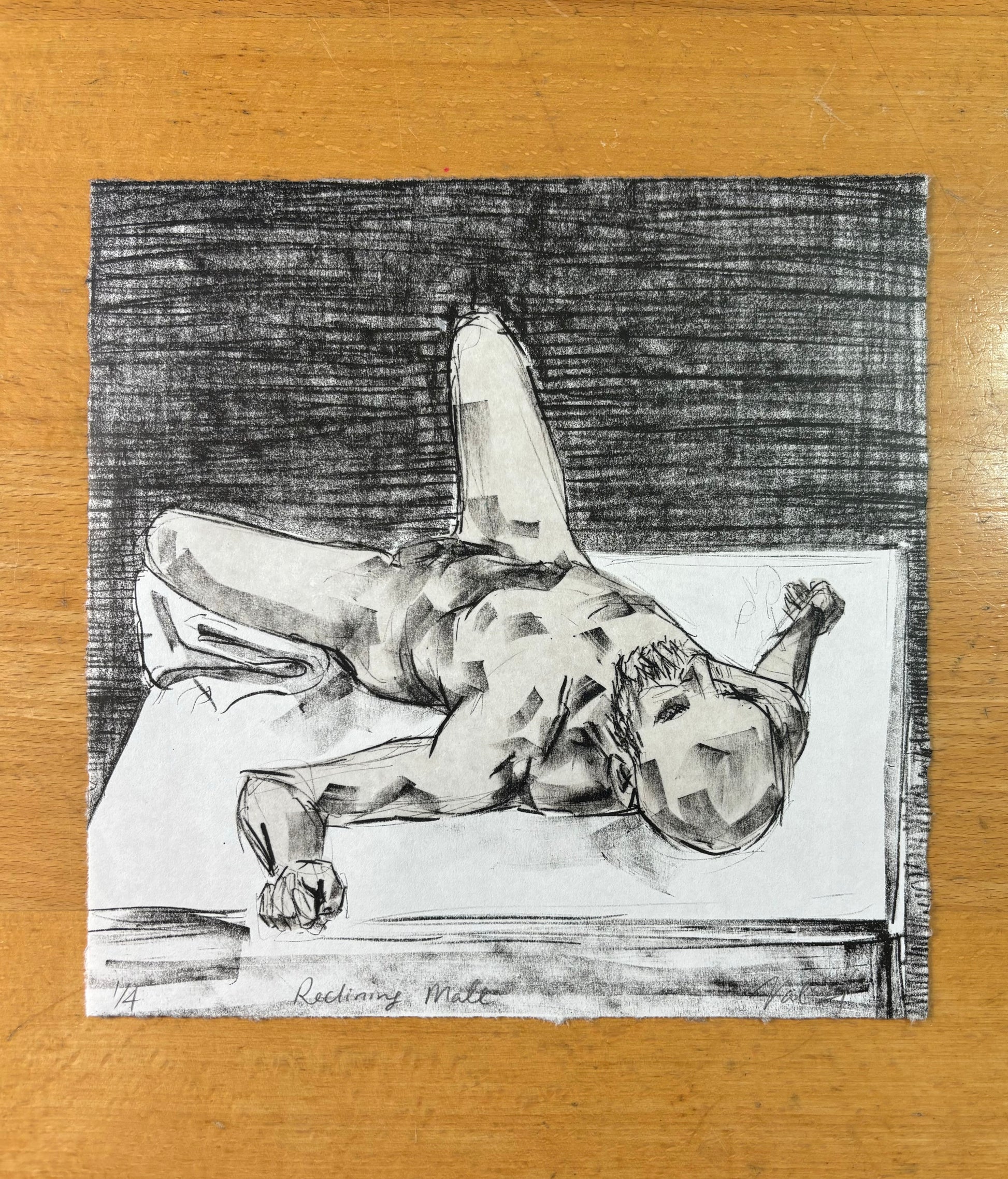 A male nude reclining on a table