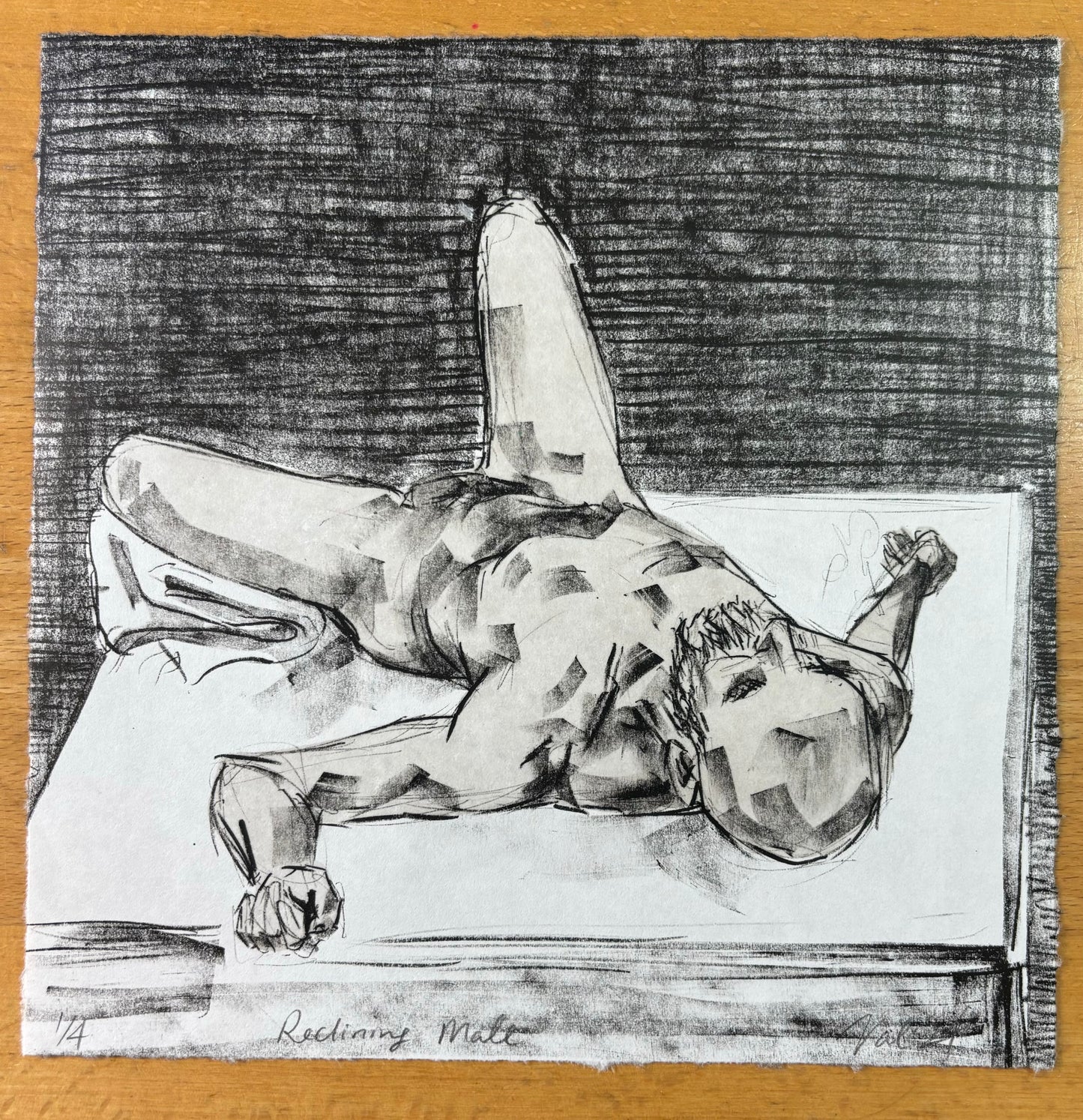 A male nude reclining on a table